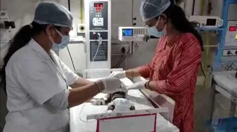 Infant Interred Living in India Battles for Existence